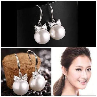 DIAMONDS AND PEARLS - Platinum Polished BOW Earrings