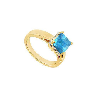 Blue Topaz and Diamond Ring : 14K Yellow Gold - 0.83 CT TGW